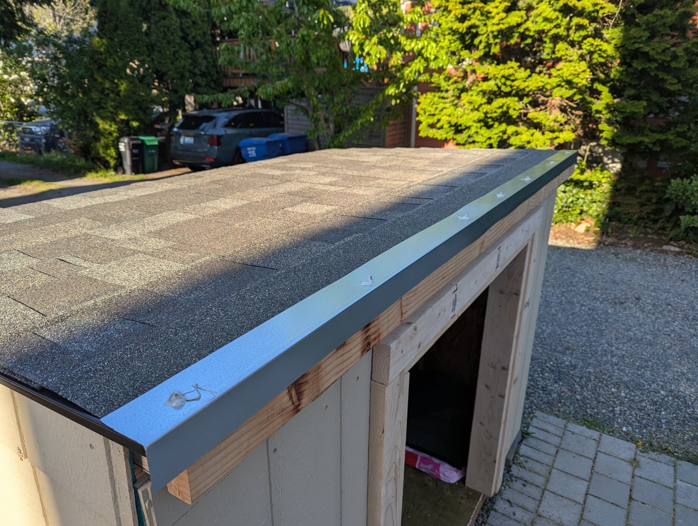 Finished roof with shingles and flashing