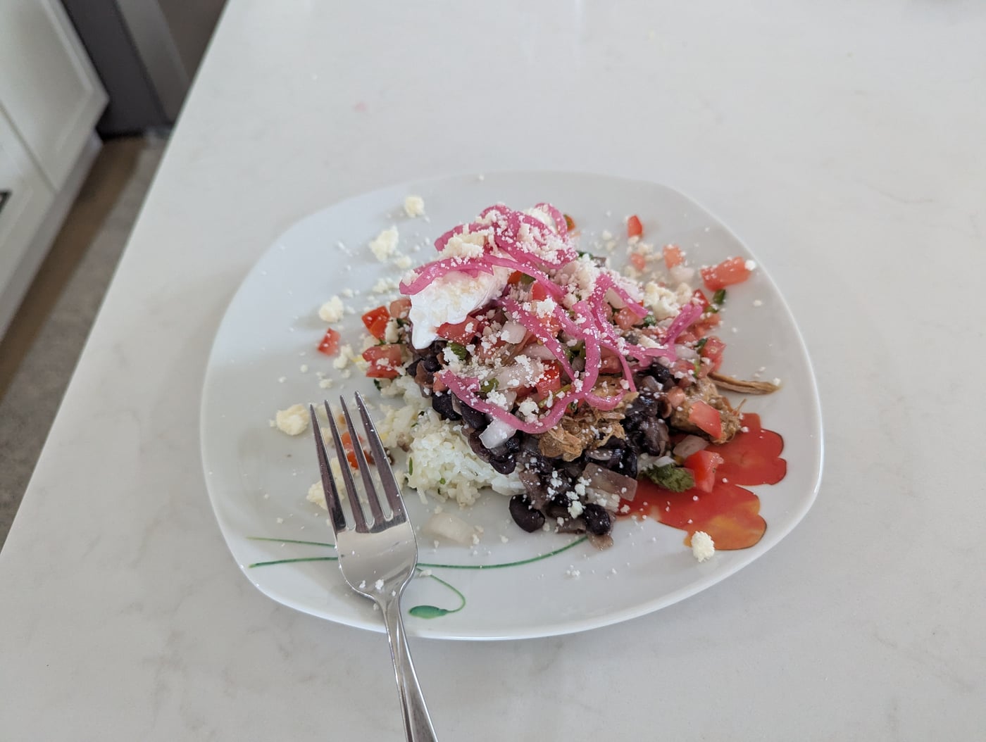 Mojo pork bowl topped with cotija