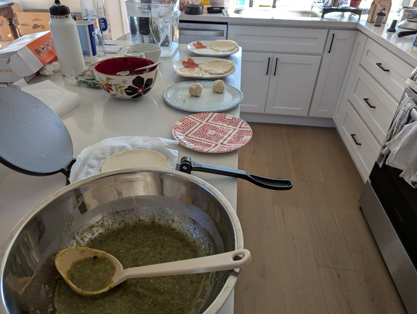 Corn tortillas and salsa verde on the side